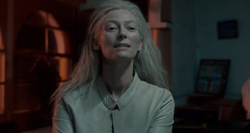 Movie still from “Only Lovers Left Alive” (2013), directed by Jim Jarmusch – A woman with long white hair is looking at the camera; Close Up shot, Over the shoulder angle