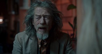 Movie still from “Only Lovers Left Alive” (2013), directed by Jim Jarmusch – An old man with a beard and long grey hair; Close Up shot, Over the shoulder angle