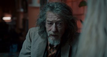 Movie still from “Only Lovers Left Alive” (2013), directed by Jim Jarmusch – An older man with a beard and a jacket; Close Up shot, Over the shoulder angle