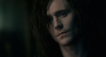 Movie still from “Only Lovers Left Alive” (2013), directed by Jim Jarmusch – A person with long black hair; Close Up shot, Over the shoulder angle