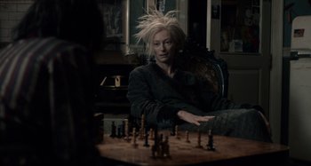 Movie still from “Only Lovers Left Alive” (2013), directed by Jim Jarmusch – A man sitting in front of a chess board; Medium shot, High angle