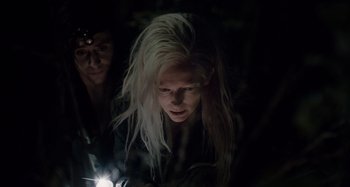 Movie still from “Only Lovers Left Alive” (2013), directed by Jim Jarmusch – A woman with long white hair is looking at a light; Close Up shot, Low angle