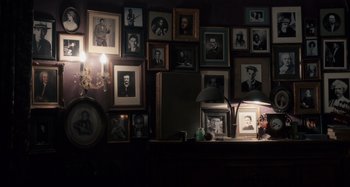 Movie still from “Only Lovers Left Alive” (2013), directed by Jim Jarmusch – Many pictures on the wall in this room; Wide shot, High angle