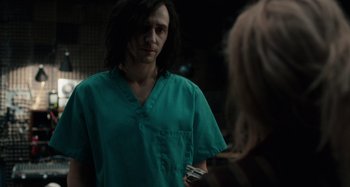 Movie still from “Only Lovers Left Alive” (2013), directed by Jim Jarmusch – A man in a green shirt is talking to a woman; Medium shot, Over the shoulder angle