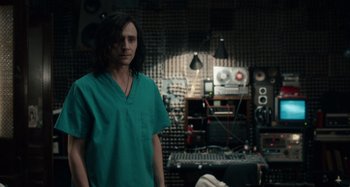 Movie still from “Only Lovers Left Alive” (2013), directed by Jim Jarmusch – A man standing in front of a sound board; Medium shot, Over the shoulder angle