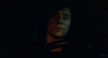 Movie still from “Only Lovers Left Alive” (2013), directed by Jim Jarmusch – A man with long black hair sitting in a car; Close Up shot, Over the shoulder angle