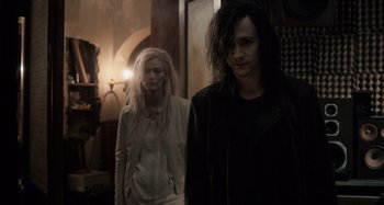 Movie still from “Only Lovers Left Alive” (2013), directed by Jim Jarmusch – A man and a woman standing next to each other in a room; Medium shot, Over the shoulder angle