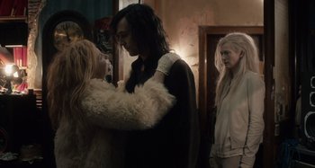 Movie still from “Only Lovers Left Alive” (2013), directed by Jim Jarmusch – A couple of people standing next to each other in a room; Medium shot, Over the shoulder angle