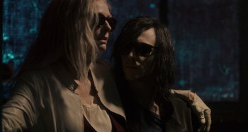 Movie still from “Only Lovers Left Alive” (2013), directed by Jim Jarmusch – Two women wearing sunglasses are standing next to each other; Medium shot, Low angle