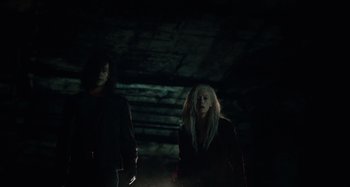 Movie still from “Only Lovers Left Alive” (2013), directed by Jim Jarmusch – Two people standing in the dark in a cave; Medium shot, Low angle