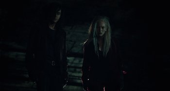 Movie still from “Only Lovers Left Alive” (2013), directed by Jim Jarmusch – Two people standing next to each other in the dark; Medium shot, Low angle