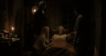Movie still from “Only Lovers Left Alive” (2013), directed by Jim Jarmusch – A group of people standing around a man in a chair; Wide shot, Over the shoulder angle