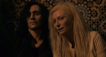 Movie still from “Only Lovers Left Alive” (2013), directed by Jim Jarmusch – A man and a woman standing next to each other; Close Up shot, Low angle