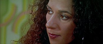 Movie still from “Talk to Her” (2002), directed by Pedro Almodóvar – A woman's face with long curly hair; Close Up shot, High angle