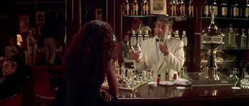 Movie still from “Talk to Her” (2002), directed by Pedro Almodóvar – A man and a woman sitting at a bar; Medium shot, Over the shoulder angle