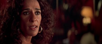 Movie still from “Talk to Her” (2002), directed by Pedro Almodóvar – A woman's face with curly red hair; Close Up shot, Over the shoulder angle