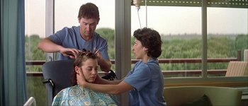 Movie still from “Talk to Her” (2002), directed by Pedro Almodóvar – A woman getting her hair cut at a hair salon; Medium shot, Over the shoulder angle