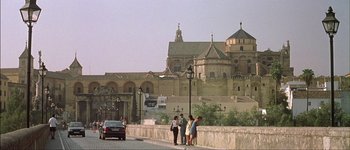 Movie still from “Talk to Her” (2002), directed by Pedro Almodóvar – A group of people standing next to each other on a bridge; Extreme Wide shot, Low angle