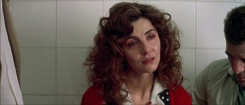 Movie still from “Talk to Her” (2002), directed by Pedro Almodóvar – A person with curly hair; Close Up shot, Over the shoulder angle