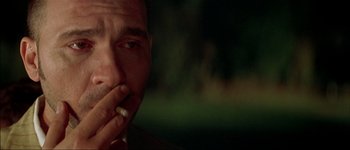 Movie still from “Talk to Her” (2002), directed by Pedro Almodóvar – A person smoking a cigarette; Extreme Close Up shot, Over the shoulder angle
