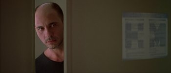 Movie still from “Talk to Her” (2002), directed by Pedro Almodóvar – A person looking at the camera; Close Up shot, Over the shoulder angle