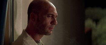 Movie still from “Talk to Her” (2002), directed by Pedro Almodóvar – A man with a bald head looking to his left; Close Up shot, Low angle