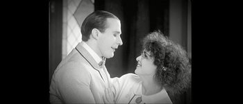 Movie still from “Talk to Her” (2002), directed by Pedro Almodóvar – A man and a woman are looking at each other; Medium shot, Low angle