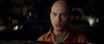 Movie still from “Talk to Her” (2002), directed by Pedro Almodóvar – A man with a bald head is looking at the camera; Close Up shot, Low angle