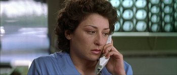 Movie still from “Talk to Her” (2002), directed by Pedro Almodóvar – A woman talking on a phone while sitting down; Close Up shot, High angle