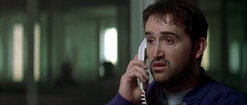 Movie still from “Talk to Her” (2002), directed by Pedro Almodóvar – A person talking on a phone; Close Up shot, Low angle