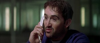 Movie still from “Talk to Her” (2002), directed by Pedro Almodóvar – A person talking on a cell phone; Close Up shot, Low angle