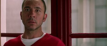 Movie still from “Talk to Her” (2002), directed by Pedro Almodóvar – A person wearing a red sweater; Close Up shot, Low angle