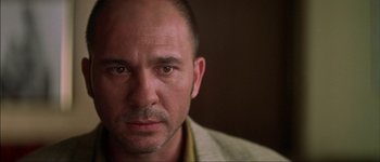 Movie still from “Talk to Her” (2002), directed by Pedro Almodóvar – A person wearing a jacket; Close Up shot, Low angle