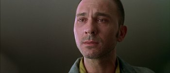 Movie still from “Talk to Her” (2002), directed by Pedro Almodóvar – A man's eyes and face; Close Up shot, Low angle