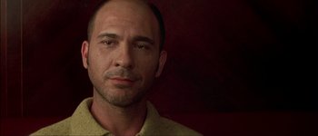 Movie still from “Talk to Her” (2002), directed by Pedro Almodóvar – A person wearing a yellow shirt; Close Up shot, Low angle