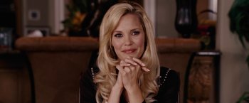 Movie still from “Talladega Nights: The Ballad of Ricky Bobby” (2006), directed by Adam McKay – A woman with long blonde hair sitting in front of a mirror; Close Up shot, Over the shoulder angle