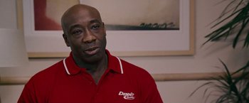 Movie still from “Talladega Nights: The Ballad of Ricky Bobby” (2006), directed by Adam McKay – A person wearing a red shirt; Close Up shot, Low angle