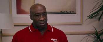 Movie still from “Talladega Nights: The Ballad of Ricky Bobby” (2006), directed by Adam McKay – A person wearing a red shirt; Close Up shot, Low angle