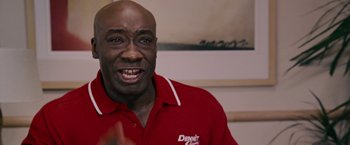 Movie still from “Talladega Nights: The Ballad of Ricky Bobby” (2006), directed by Adam McKay – A person wearing a red shirt; Close Up shot, Low angle