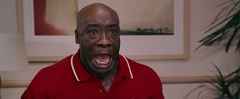 Movie still from “Talladega Nights: The Ballad of Ricky Bobby” (2006), directed by Adam McKay – A person with his mouth wide open; Close Up shot, Low angle