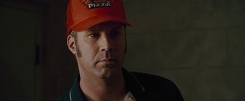 Movie still from “Talladega Nights: The Ballad of Ricky Bobby” (2006), directed by Adam McKay – A person wearing a hat; Close Up shot, Over the shoulder angle