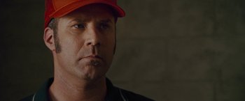 Movie still from “Talladega Nights: The Ballad of Ricky Bobby” (2006), directed by Adam McKay – A person wearing a hat; Close Up shot, Over the shoulder angle