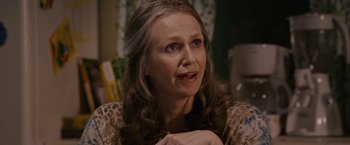 Movie still from “Talladega Nights: The Ballad of Ricky Bobby” (2006), directed by Adam McKay – An older woman with long gray hair and blue eyes; Close Up shot, Over the shoulder angle