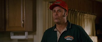 Movie still from “Talladega Nights: The Ballad of Ricky Bobby” (2006), directed by Adam McKay – A person wearing a hat; Close Up shot, Over the shoulder angle