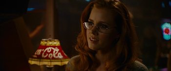 Movie still from “Talladega Nights: The Ballad of Ricky Bobby” (2006), directed by Adam McKay – A person wearing glasses; Close Up shot, Over the shoulder angle