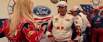 Movie still from “Talladega Nights: The Ballad of Ricky Bobby” (2006), directed by Adam McKay – A man and a woman are talking to each other; Medium shot, Over the shoulder angle