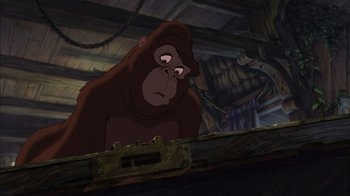 Movie still from “Tarzan” (1999), directed by Kevin Lima – A gorilla is standing on a wooden platform; Medium shot, Low angle
