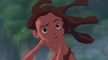 Movie still from “Tarzan” (1999), directed by Kevin Lima – A cartoon character with long brown hair; Medium shot, Overhead angle