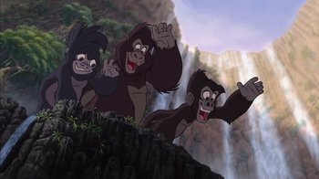 Movie still from “Tarzan” (1999), directed by Kevin Lima – A group of three monkeys standing next to each other near a waterfall; Wide shot, Low angle