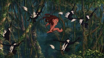 Movie still from “Tarzan” (1999), directed by Kevin Lima – An animated picture of a monkey and a monkey bird; Wide shot, Low angle